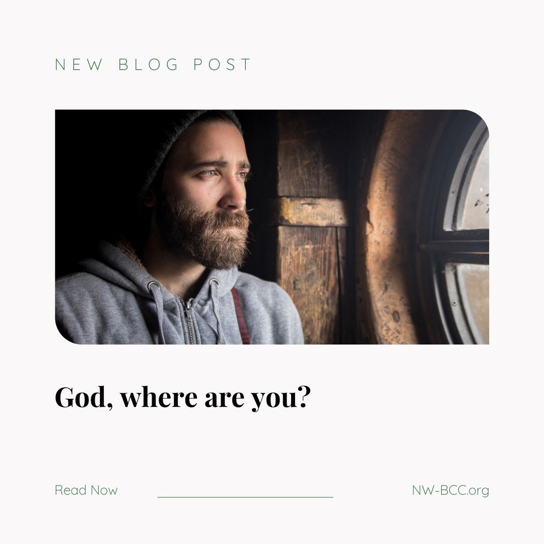 New Blog Post - "God, where are you?" with a picture of sad man with a beard looking through a round, wood framed window.