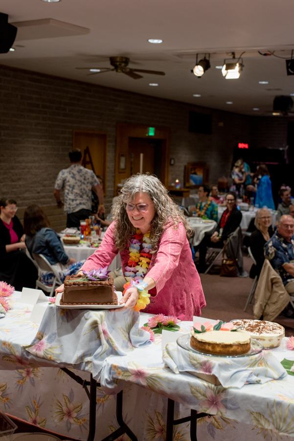 Woman taking a dessert from the table